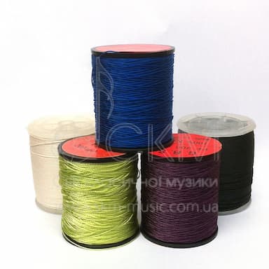 Thread for making bassoon reeds, in a spool, different colors